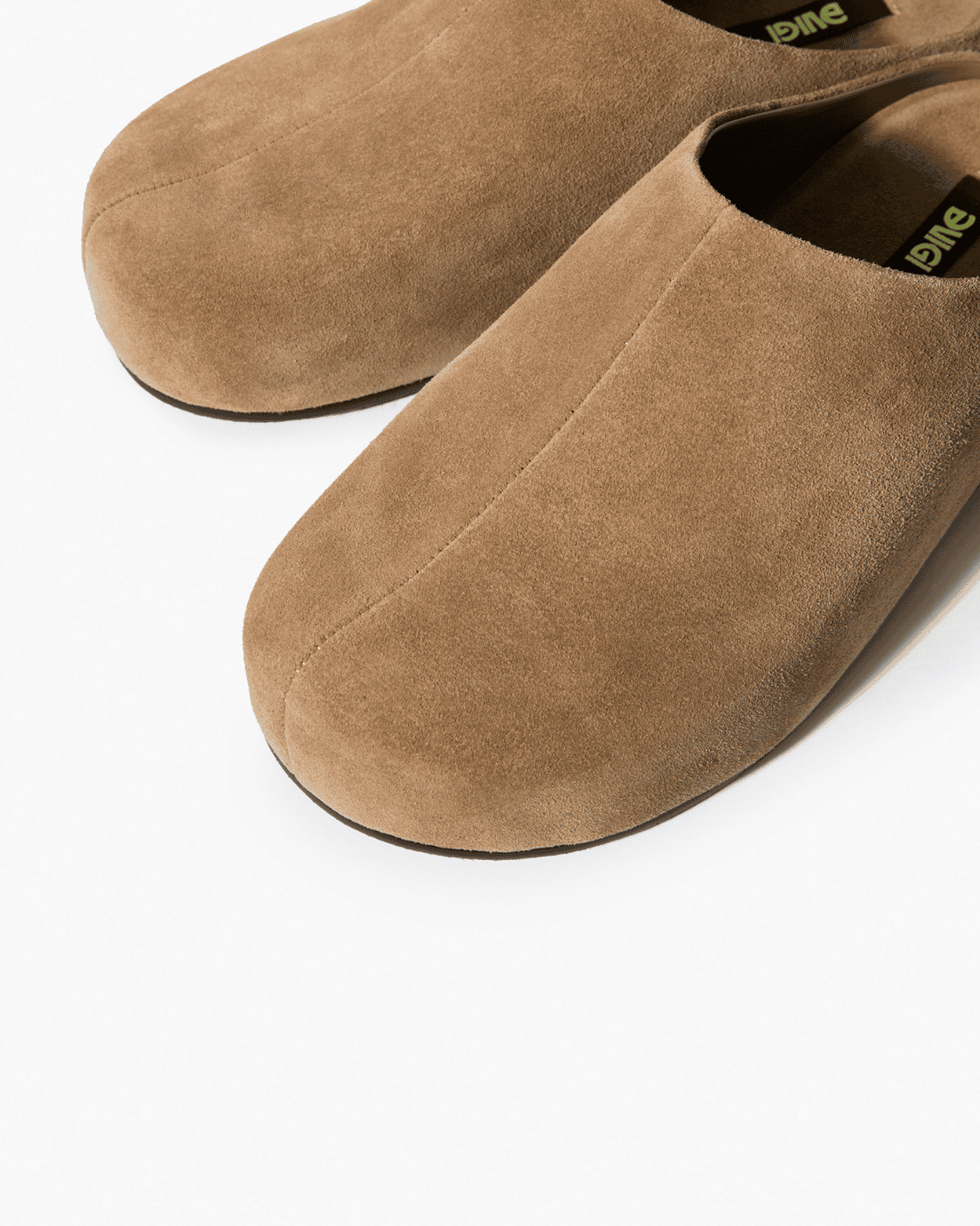 Taupe suede clogs with closed toe and centre seam detail